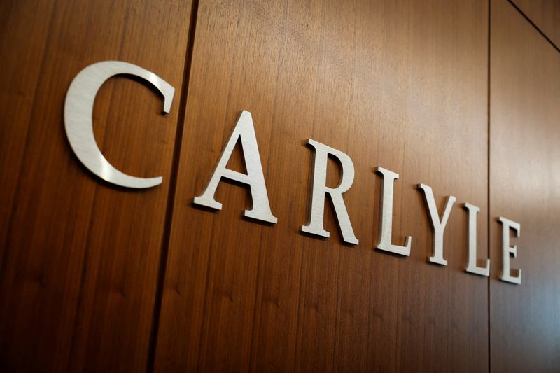 &copy; Reuters. FILE PHOTO: Carlyle signage displays at the office in Manhattan in New York City, U.S., February 26, 2025. REUTERS/Jeenah Moon/File Photo