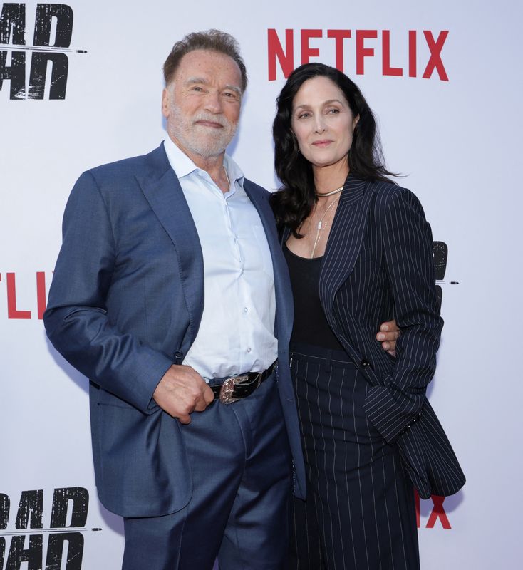 &copy; Reuters. Arnold Schwarzenegger e Carrie-Anne Moss em Los Angelesn 11/6/2025    REUTERS/Mario Anzuoni