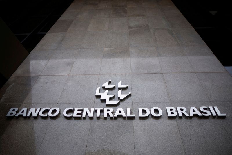 Brazil central bank raises rates, sees "very prolonged" pause