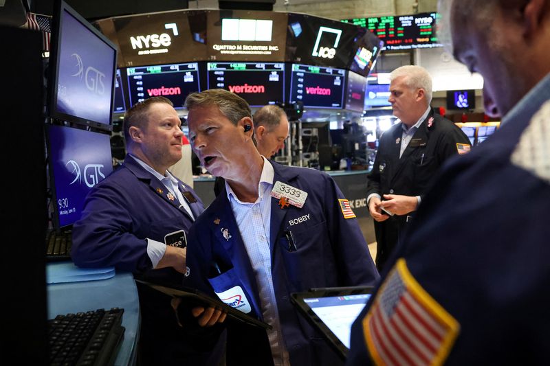 Nasdaq, S&P 500 close lower, weighed by tech stocks, Dow ends up