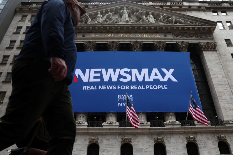 &copy; Reuters. FILE PHOTO: A banner for Newsmax Inc. is displayed during the company’s IPO at the New York Stock Exchange (NYSE) in New York City, U.S., March 31, 2025.  REUTERS/Brendan McDermid/File Photo