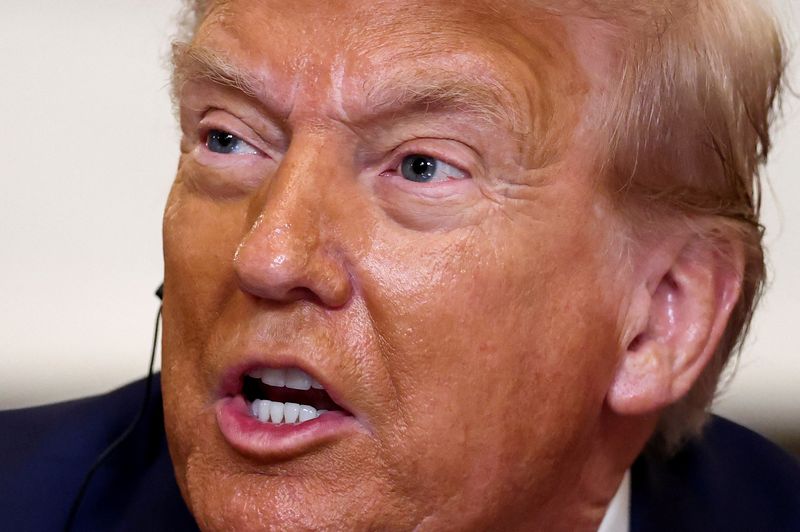 &copy; Reuters. FILE PHOTO: U.S. President Donald Trump reacts, as he hosts a lunch for African leaders of Gabon, Guinea-Bissau, Liberia, Mauritania, and Senegal in the State Dining Room at the White House in Washington, D.C., U.S., July 9, 2025. REUTERS/Kevin Lamarque/F