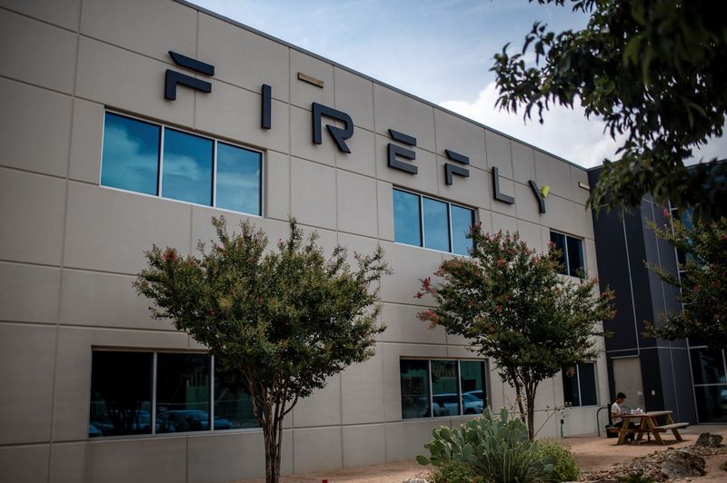 &copy; Reuters. FILE PHOTO: A person sits outside the Firefly Aerospace mission operations center in Leander, Texas, U.S., July 9, 2025.   REUTERS/Sergio Flores/ File Photo