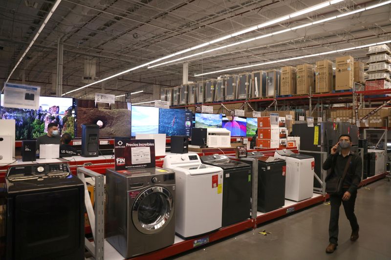 &copy; Reuters. FILE PHOTO: A shopper walks next to appliances during the opening of Mexican shopping season event "El Buen Fin" (The Good Weekend) as the consumers buy emulating the "Black Friday" shopping, at Sam's Club store in Mexico City, Mexico, November 10, 2021.