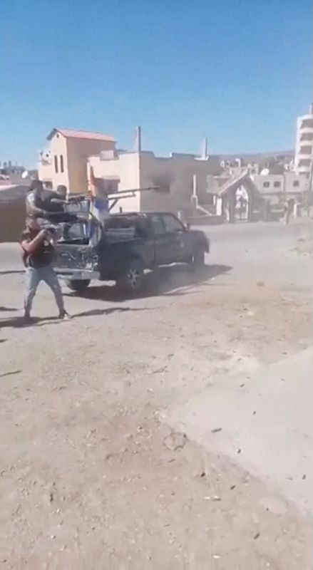 Attacks on Syrian security forces sent to quell sectarian clashes leave 18 dead as Israel strikes targets to protect Druze