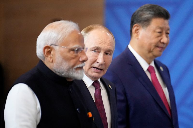 &copy; Reuters. Narendra Modi, Vladimir Putin e Xi Jinping em Kazann 23/10/2024     Alexander Zemlianichenko/Pool via REUTERS