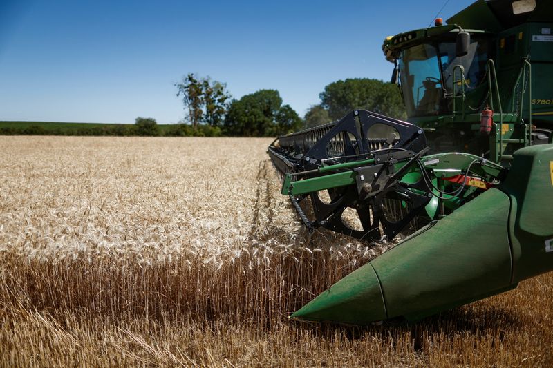 Deere warns of bigger tariff hit after quarterly profit declines