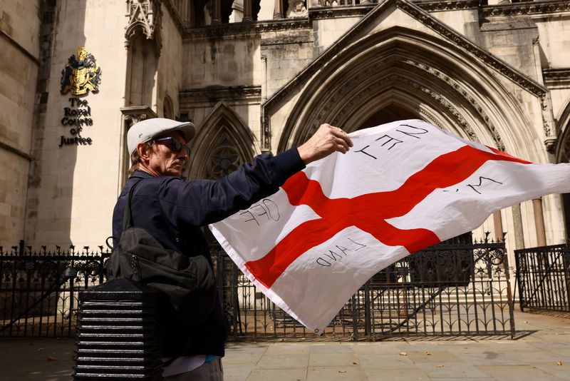 UK wins court ruling to keep asylum seekers in hotel but risks angry response