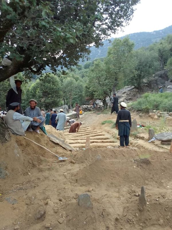 Afghan quake survivors dig graves with pickaxes as entire households wiped out