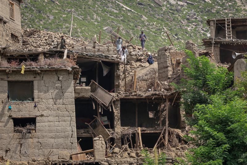 Afghan earthquake survivors hunt loved ones, pull planks from rubble for graves