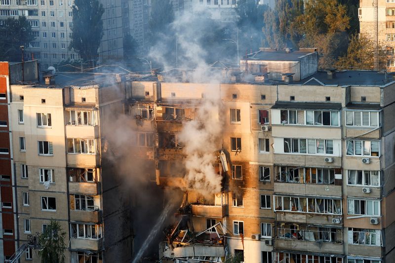 Russia hits Ukraine with biggest air attack of war, sets government building ablaze