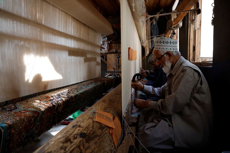Hobbled by US tariffs, carpet weavers in India’s Kashmir struggle to stay afloat