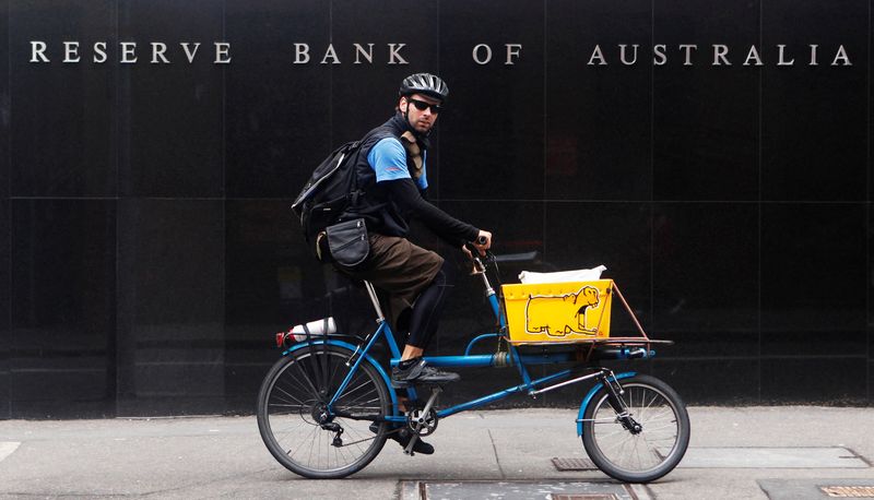 Australia’s central bank holds rates steady, cautious about inflation