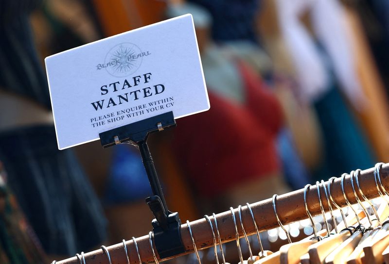 UK's jobs downturn abates slightly ahead of budget, survey shows