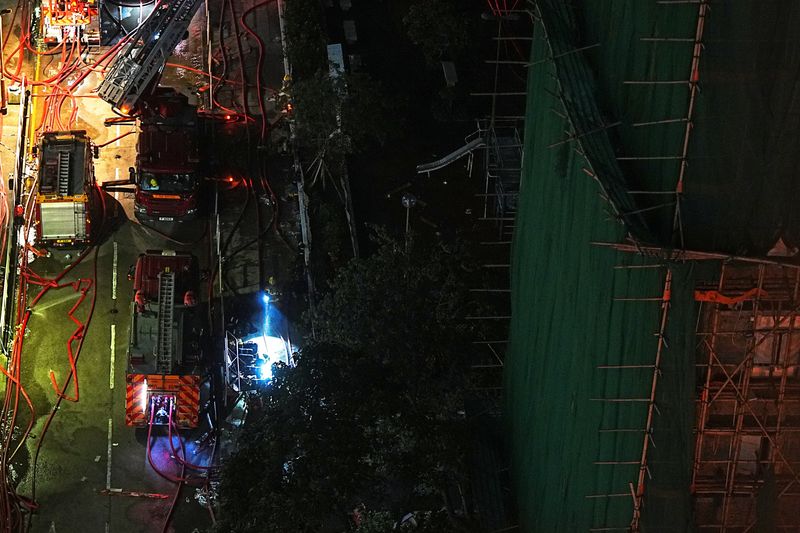 Anger simmers over Hong Kong deadly blaze as Beijing warns against "disruption"