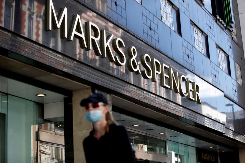 © Reuters. FILE PHOTO: A woman walks past a Marks & Spencer store at Oxford Street, amid the outbreak of the coronavirus disease (COVID-19), in London, Britain, July 20, 2020. REUTERS/Henry Nicholls