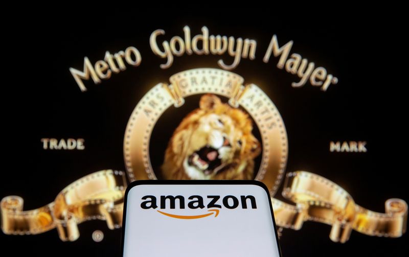© Reuters. FILE PHOTO: Smartphone with Amazon logo is seen in front of displayed MGM logo in this illustration taken, May 26, 2021. REUTERS/Dado Ruvic/Illustration