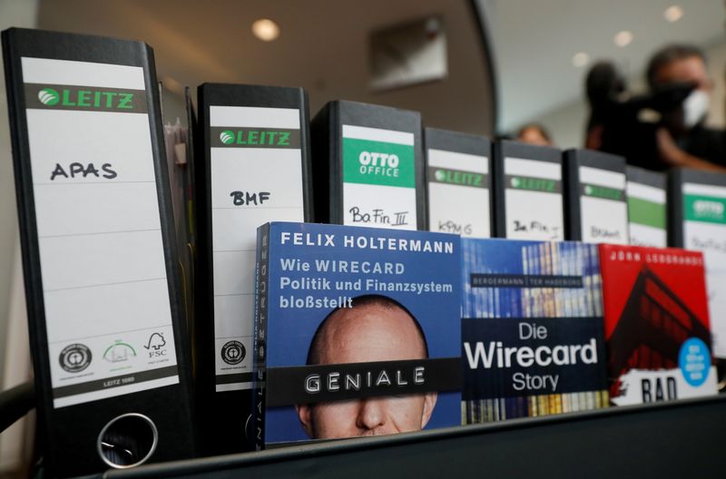 &copy; Reuters. FILE PHOTO: Wirecard acts and books about the company are pictured, in Berlin, Germany April 22, 2021. REUTERS/Michele Tantussi