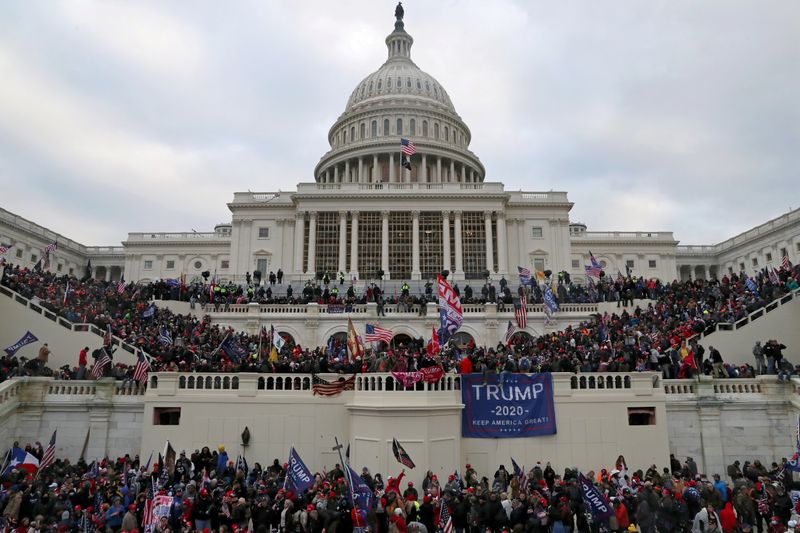 &copy; Reuters. FILE PHOTO: A mob of supporters of U.S. President Donald Trump storm the U.S. Capitol Building in Washington, U.S., January 6, 2021. Picture taken January 6, 2021. REUTERS/Leah Millis/File Photo