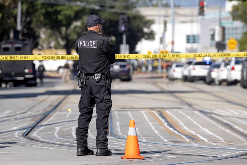 © Reuters. Police secure the scene of a mass shooting at a rail yard run by the Santa Clara Valley Transportation Authority in San Jose, California, U.S. May 26, 2021.  REUTERS/Peter DaSilva