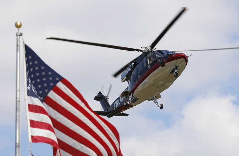 &copy; Reuters. U.S. Republican presidential candidate Donald Trump's helicopter lands in a field before his visit to the Iowa State Fair during a campaign stop in Des Moines, Iowa, United States, August 15, 2015.  REUTERS/Jim Young  