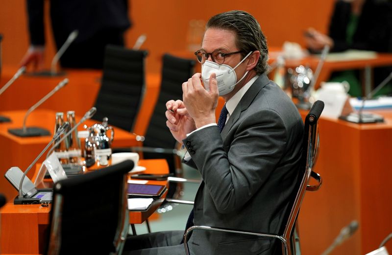 &copy; Reuters. FILE PHOTO: German Transport Minister Andreas Scheuer adjusts his face mask as he attends the weekly cabinet meeting at the Chancellery in Berlin, Germany May 12, 2021. Michael Sohn/Pool via REUTERS