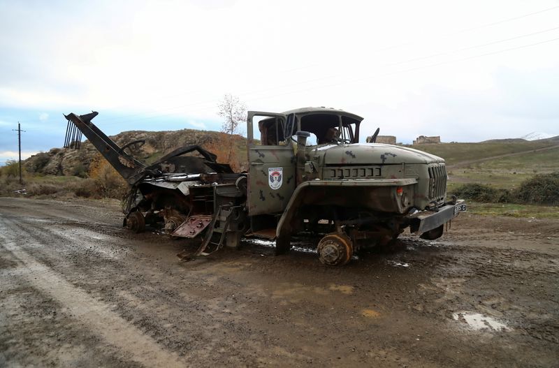 &copy; Reuters. FILE PHOTO: A view shows a damaged truck belonging to ethnic Armenian forces in an area that came under the control of Azerbaijan's troops following a military conflict over Nagorno-Karabakh, in Jabrayil District, December 7, 2020. Picture taken December 