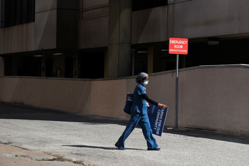 &copy; Reuters. FILE PHOTO: A healthcare worker leaves Houston Methodist Hospital, as social distancing guidelines to curb the spread of the coronavirus disease (COVID-19) are relaxed in Houston, Texas, U.S. May 4, 2020. REUTERS/Callaghan O'Hare