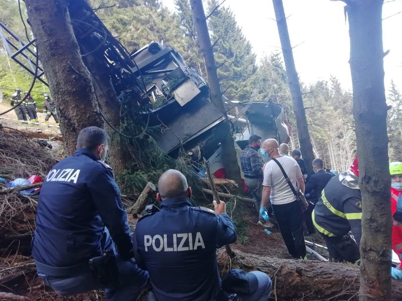 &copy; Reuters. Police and rescue service members are seen near the crashed cable car after it collapsed in Stresa, near Lake Maggiore, Italy May 23, 2021. ITALIAN POLICE/Handout via REUTERS THIS IMAGE HAS BEEN SUPPLIED BY A THIRD PARTY.