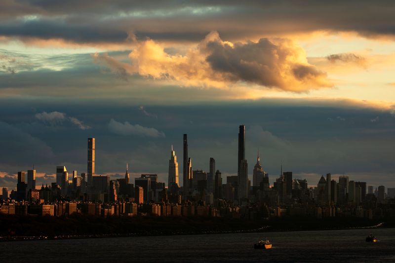 &copy; Reuters. FILE PHOTO: Barges sit at anchor on the Hudson River as sunset falls on the skyline of the west side of Manhattan in New York City, New York, U.S., December 1, 2020. REUTERS/Mike Segar