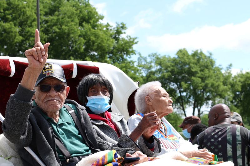 &copy; Reuters. FILE PHOTO: Hughes Van Ellis, 100, Lessie Benningfield Randle, 106, also known as Mother Randle, and Viola Fletcher, 107, the oldest living survivor of the Tulsa Race Massacre and older sister of Van Ellis, attend the Black Wall Street Legacy Festival 202