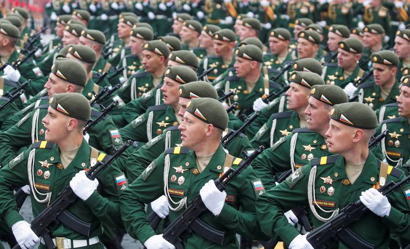 &copy; Reuters. Russian service members march during a military parade on Victory Day, which marks the 76th anniversary of the victory over Nazi Germany in World War Two, in Red Square in central Moscow, Russia May 9, 2021. REUTERS/Maxim Shemetov