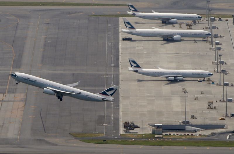 &copy; Reuters. FILE PHOTO: A Cathay Pacific Airways passenger flight takes off at Hong Kong Airport in Hong Kong, China June 12, 2015.  REUTERS/Bobby Yip/File Photo