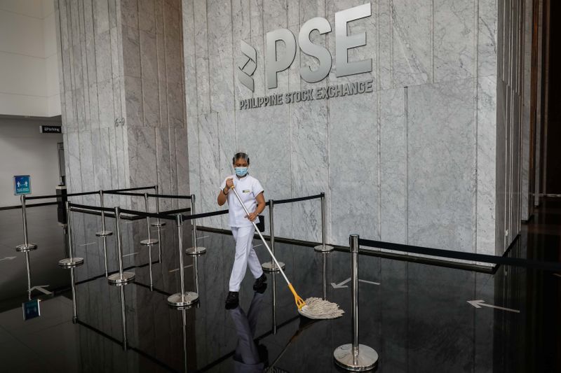 &copy; Reuters. A janitor wearing a face mask cleans the lobby of the Philippine Stock Exchange amid the coronavirus disease (COVID-19) outbreak, in Taguig City, Metro Manila, Philippines, September 30, 2020. REUTERS/Eloisa Lopez