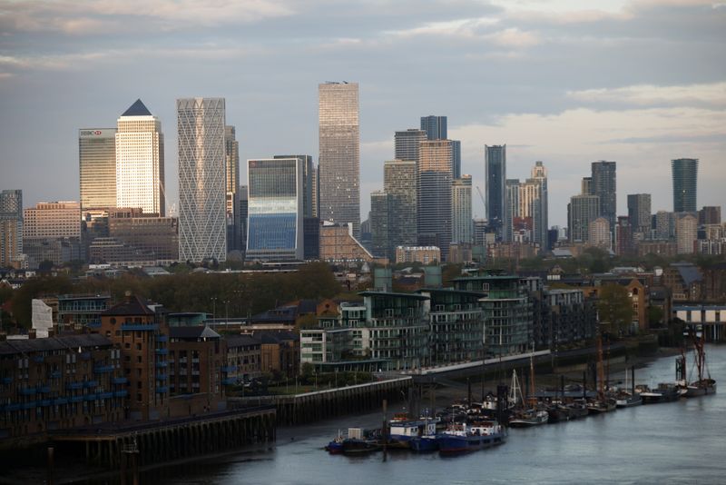 &copy; Reuters. FILE PHOTO: Skyscrapers in The City of London financial district are seen from City Hall in London, Britain, May 8, 2021. REUTERS/Henry Nicholls//File Photo