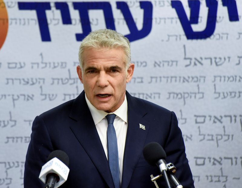 &copy; Reuters. FILE PHOTO: Yair Lapid, head of the centrist Yesh Atid party, delivers a statement to the press before the party faction meeting at the Knesset, Israel's parliament, in Jerusalem May 31, 2021. Debbie Hill/Pool via REUTERS
