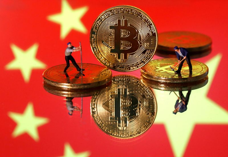 &copy; Reuters. FILE PHOTO: Small toy figurines are seen on representations of the Bitcoin virtual currency displayed in front of an image of China's flag in this illustration picture, April 9, 2019. REUTERS/Dado Ruvic/Illustration/File Photo