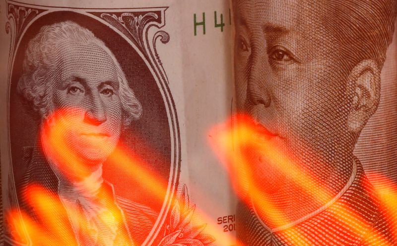 &copy; Reuters. Chinese Yuan and U.S. dollar banknotes are seen behind illuminated stock graph in this illustration taken February 10, 2020. REUTERS/Dado Ruvic/Illustration
