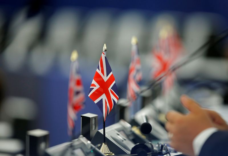 © Reuters. FILE PHOTO: British Union Jack flags are seen on the desks of Members of the Brexit Party during a debate on the last European summit, at the European Parliament in Strasbourg, France, July 4, 2019.  REUTERS/Vincent Kessler
