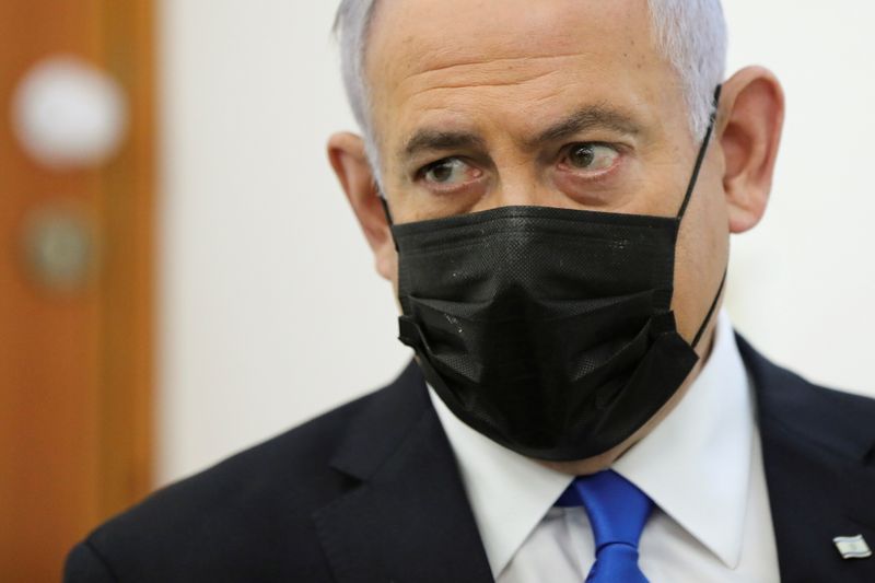 &copy; Reuters. FILE PHOTO: Israeli Prime Minister Benjamin Netanyahu, wearing a face mask, looks as his corruption trial resumes, at Jerusalem's District Court April 5, 2021. Abir Sultan/Pool via REUTERS