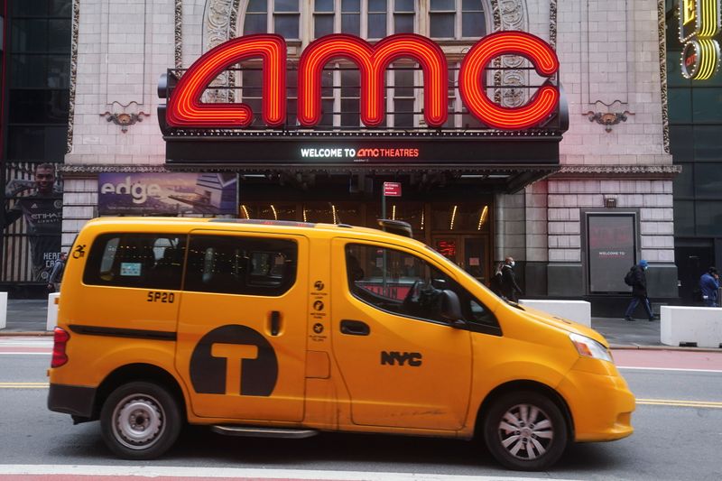 &copy; Reuters. FILE PHOTO: A taxi passes an AMC theatre amid the coronavirus disease (COVID-19) pandemic in the Manhattan borough of New York City, New York, U.S., January 27, 2021. REUTERS/Carlo Allegri