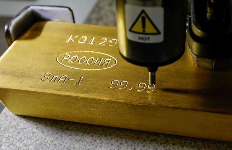 &copy; Reuters. A machine engraves information on an ingot of 99.99 percent pure gold at a plant owned by Krastsvetmet, one of the world's biggest manufacturers of non-ferrous metals, in Krasnoyarsk, Russia April 9, 2019. Picture taken April 9, 2019.  REUTERS/Ilya Naymus