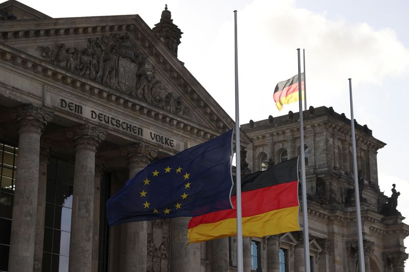 &copy; Reuters. The European Union and German flags fly at half-mast for the victims of a shooting that left several people dead in Hanau near Frankfurt, in front of the Reichstag building, the seat of the lower house of parliament Bundestag, in Berlin, Germany, February