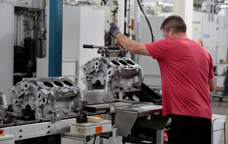 &copy; Reuters. FILE PHOTO: A General Motors assembly worker loads engine block castings on to the assembly line at the GM Romulus Powertrain plant in Romulus, Michigan, U.S. August 21, 2019. Rebecca Cook/File Photo