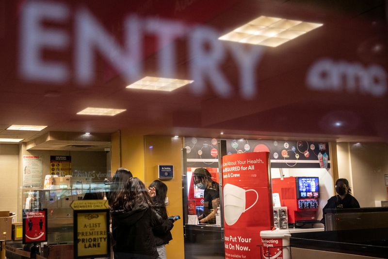 &copy; Reuters. FILE PHOTO: Moviegoers check in at AMC movie theater amid the coronavirus disease (COVID-19) pandemic in the Manhattan borough of New York City, New York, U.S., March 5, 2021. REUTERS/Jeenah Moon