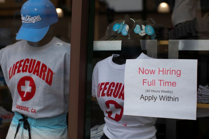 &copy; Reuters. FILE PHOTO: A clothing store advertises a full time job on its shop window in Oceanside, California, U.S., May 10, 2021. REUTERS/Mike Blake