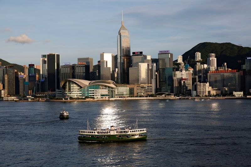 &copy; Reuters. FILE PHOTO: A Star Ferry boat crosses Victoria Harbour in front of a skyline of buildings in Hong Kong, China June 29, 2020. REUTERS/Tyrone Siu