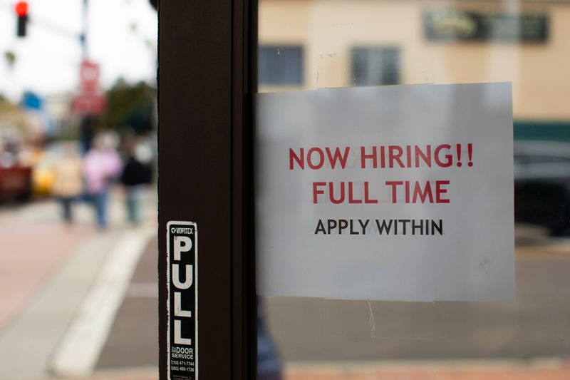 &copy; Reuters. FILE PHOTO: A retail store advertising a full time job on its open door in Oceanside, California, U.S., May 10, 2021. REUTERS/Mike Blake