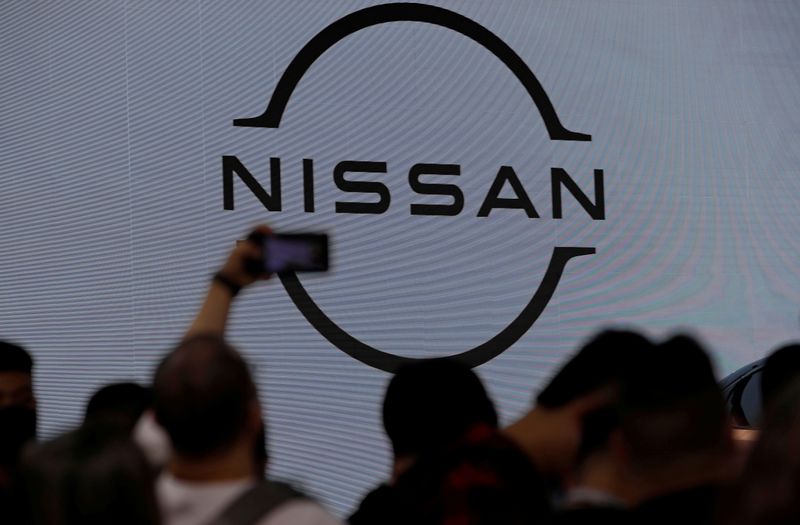 &copy; Reuters. FILE PHOTO: People visit the Nissan booth at the Beijing International Automotive Exhibition, or Auto China show, in Beijing, China September 26, 2020. REUTERS/Thomas Peter