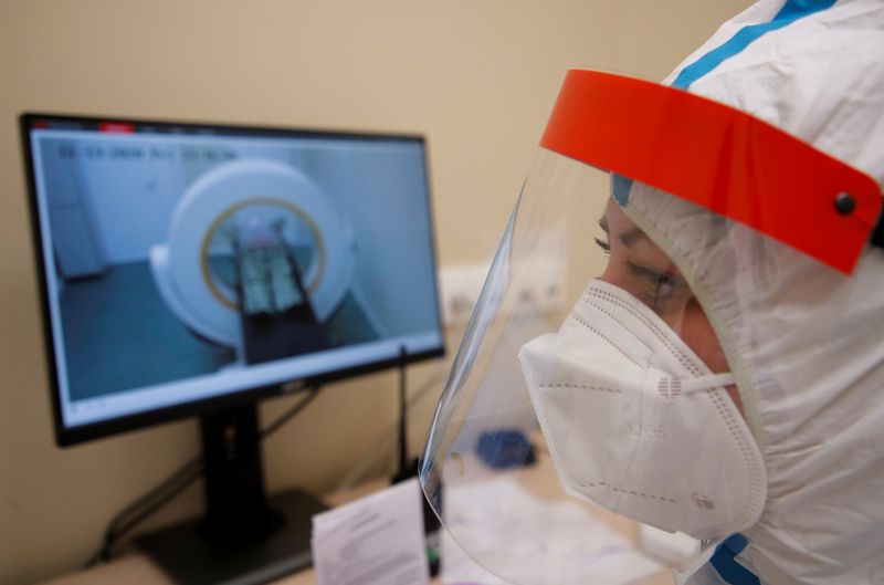 &copy; Reuters. A medical worker looks on at a temporary hospital in the Krylatskoye Ice Palace, where patients suffering from the coronavirus disease (COVID-19) are treated, in Moscow, Russia November 13, 2020. Picture taken November 13, 2020. REUTERS/Maxim Shemetov